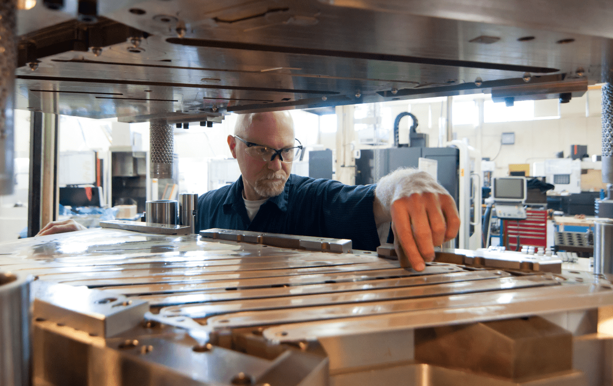  A tool and die maker checking out the die 